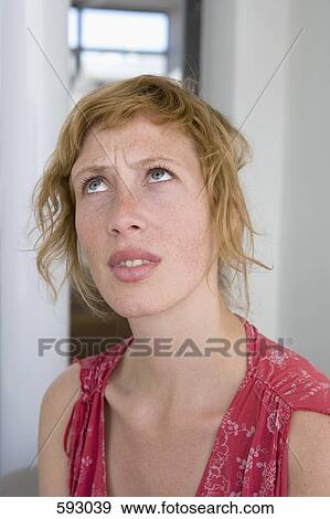 Portrait of a woman looking up View Large Photo Image Stock Photo - Portrait of a woman looking up. Fotosearch