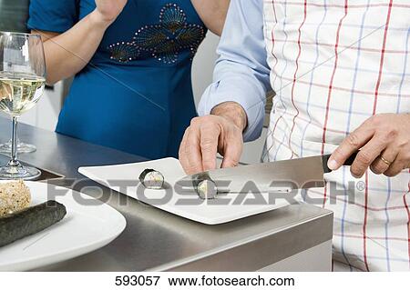 Stock Photo - Preparing sushi in a kitchen. Fotosearch