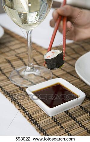 Stock Image - Sushi, soy sauce and a glass of wine. Fotosearch