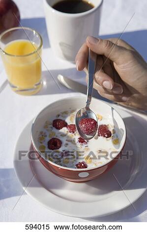 Detail of a woman eating cereal with fruit View Large Photo Image Stock Photography - Detail of a woman eating cereal with fruit. Fotosearch