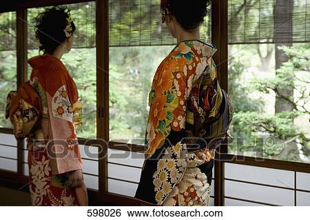 Stock Photograph - Two women wearing kimonos. Fotosearch