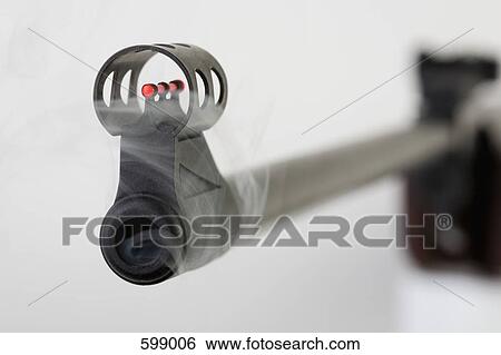 Stock Photograph - A smoking gun. Fotosearch