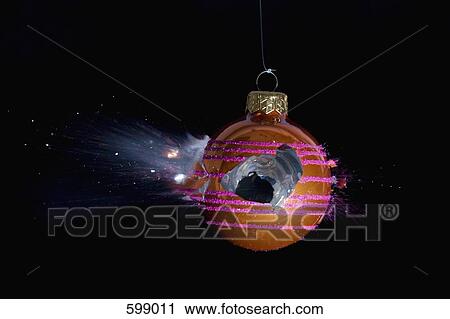 Stock Image - An exploding Christmas bauble. Fotosearch