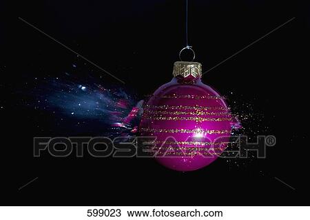 Stock Image - An exploding Christmas bauble. Fotosearch