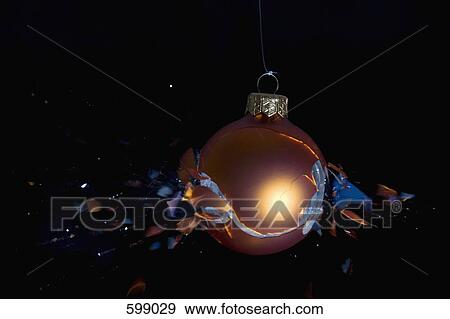 An exploding Christmas bauble View Large Photo Image Stock Photo - An exploding Christmas bauble. Fotosearch