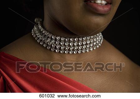 A woman wearing a diamond necklace View Large Photo Image Stock Image - A woman wearing a diamond necklace. Fotosearch