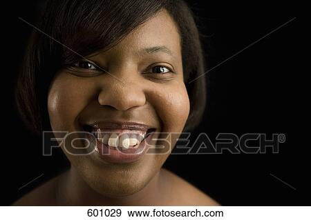 Portrait of a woman smiling View Large Photo Image Stock Photo - Portrait of a woman smiling. Fotosearch