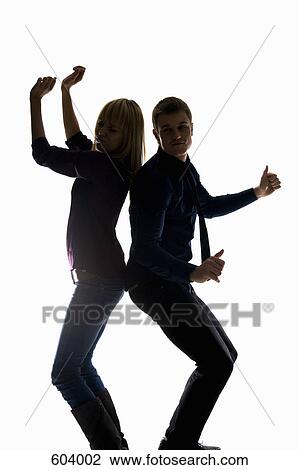 Studio shot of a man and a woman dancing View Large Photo Image Stock Image - Studio shot of a man and a woman dancing. Fotosearch