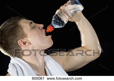 A man drinking water and sweating View Large Photo Image Stock Image - A man drinking water and sweating. Fotosearch