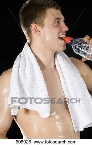 A man drinking water and sweating View Large Photo Image Stock Photograph - A man drinking water and sweating. Fotosearch