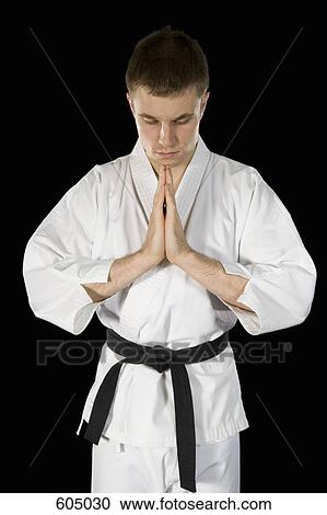 A young man practicing karate View Large Photo Image Stock Image - A young man practicing karate. Fotosearch