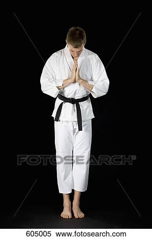 Stock Photography - A young man wearing a karate suit. Fotosearch