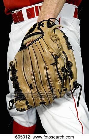 Midsection of a baseball player wearing a baseball glove View Large Photo Image Stock Image - Midsection of a baseball player wearing a baseball glove. Fotosearch
