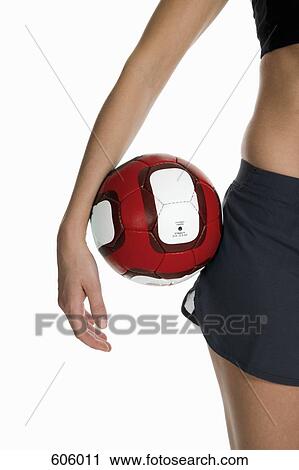 A female athlete holding a volleyball View Large Photo Image Stock Image - A female athlete holding a volleyball. Fotosearch