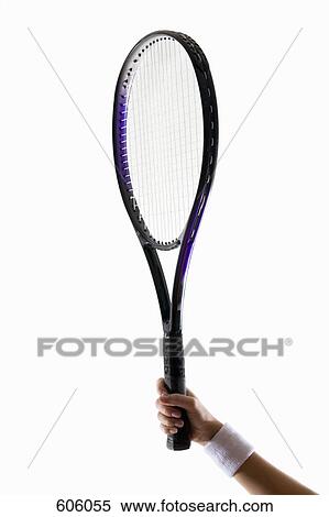 A human arm holding a tennis racket up View Large Photo Image Stock Photography - A human arm holding a tennis racket up. Fotosearch
