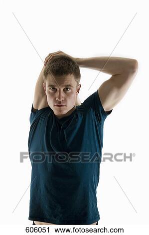A male stretching his arm behind his head View Large Photo Image Stock Image - A male stretching his arm behind his head. Fotosearch