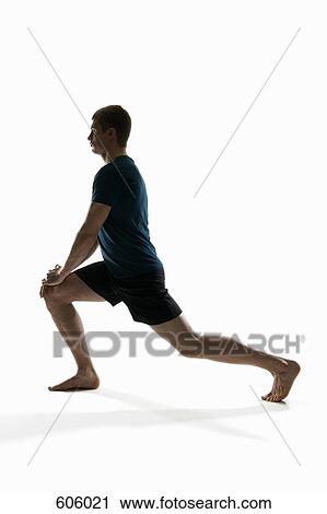 A man stretching in a lunge pose View Large Photo Image Stock Image - A man stretching in a lunge pose. Fotosearch