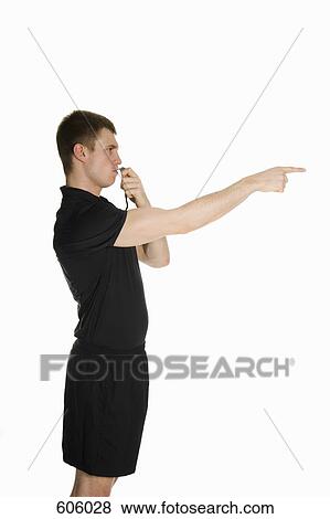 A side view studio portrait of a referee blowing a whistle and pointing View Large Photo Image Stock Photo - A side view studio portrait of a referee blowing a whistle and pointing. Fotosearch