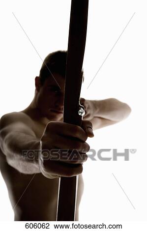 Silhouette of archer pulling an arrow back on his longbow View Large Photo Image Stock Image - Silhouette of archer pulling an arrow back on his longbow. Fotosearch