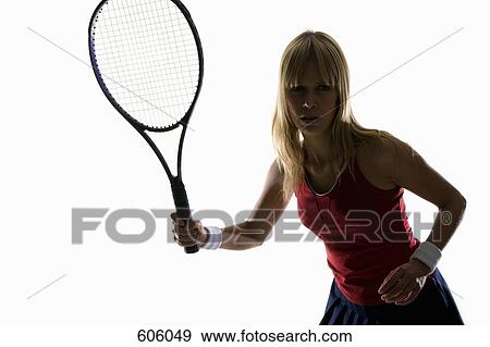 studio portrait of a female tennis player holding a tennis racket View Large Photo Image Stock Photo - studio portrait of a female tennis player holding a tennis racket. Fotosearch