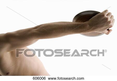 Studio portrait of a male discus thrower holding a discus View Large Photo Image Stock Photograph - Studio portrait of a male discus thrower holding a discus. Fotosearch