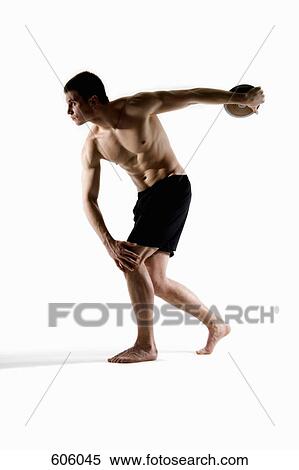 Studio portrait of a male discus thrower holding a discus View Large Photo Image Stock Photography - Studio portrait of a male discus thrower holding a discus. Fotosearch