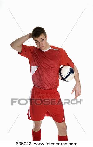 studio Portrait of a soccer player holding a soccer ball View Large Photo Image Stock Image - studio Portrait of a soccer player holding a soccer ball. Fotosearch