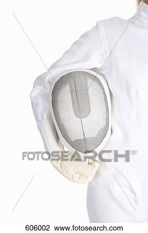 Studio shot of a female fencer holding a fencing mask View Large Photo Image Stock Image - Studio shot of a female fencer holding a fencing mask. Fotosearch