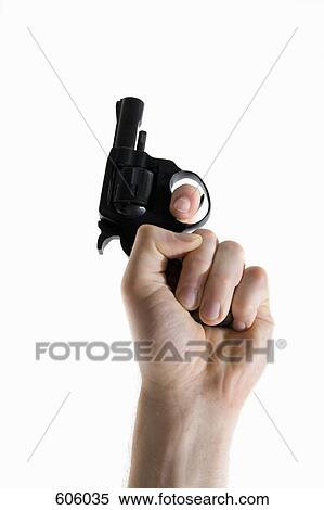 Studio shot of a human hand holding a starting gun View Large Photo Image Stock Photography - Studio shot of a human hand holding a starting gun. Fotosearch