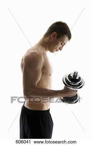 Studio shot of a male athlete lifting a dumbbell View Large Photo Image Stock Image - Studio shot of a male athlete lifting a dumbbell. Fotosearch