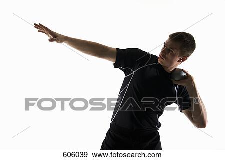 Studio shot of a male track and field athlete holding a shot put ball View Large Photo Image Stock Photo - Studio shot of a male track and field athlete holding a shot put ball. Fotosearch