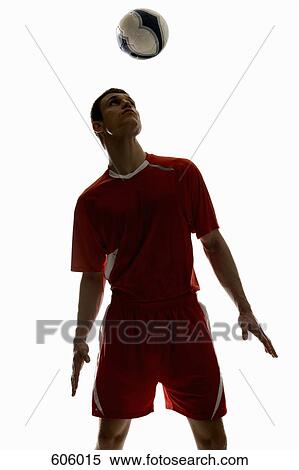 Studio shot of a soccer player bouncing a soccer ball on his head View Large Photo Image Stock Photography - Studio shot of a soccer player bouncing a soccer ball on his head. Fotosearch