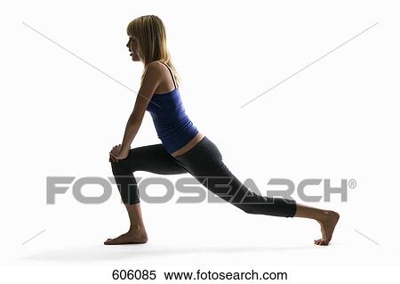Studio shot of a woman in a lunge pose View Large Photo Image Stock Photography - Studio shot of a woman in a lunge pose. Fotosearch
