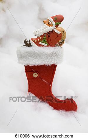 A Christmas stocking with a biscuit inside View Large Photo Image Stock Photograph - A Christmas stocking with a biscuit inside. Fotosearch