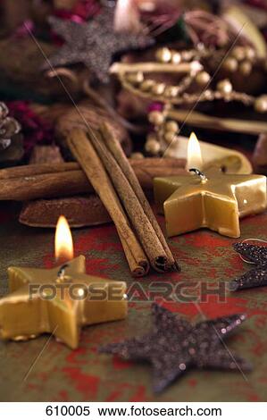 Stock Photography - Candles and Christmas decorations. Fotosearch