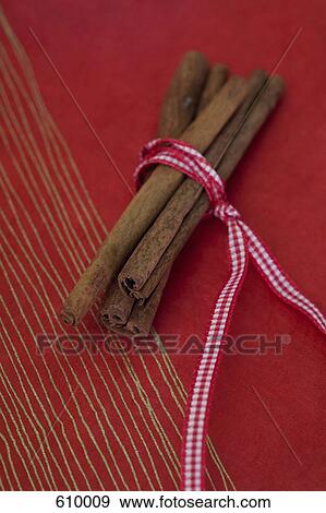 Cinnamon tied up with ribbon View Large Photo Image Stock Photo - Cinnamon tied up with ribbon. Fotosearch