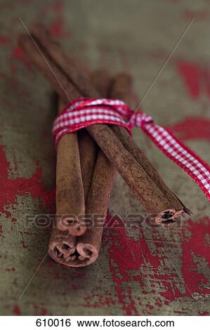 Cinnamon wrapped in ribbon View Large Photo Image Stock Photograph - Cinnamon wrapped in ribbon. Fotosearch