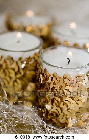 Stock Photo - Decorative candles burning. Fotosearch