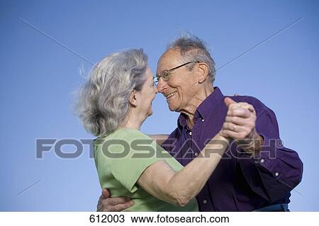 Stock Image - A senior couple dancing. Fotosearch