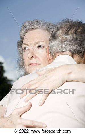 Stock Image - A senior couple embracing. Fotosearch