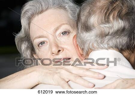 A senior couple embracing View Large Photo Image Stock Photo - A senior couple embracing. Fotosearch