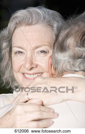 A senior couple embracing View Large Photo Image Stock Photograph - A senior couple embracing. Fotosearch