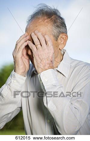 A senior man covering his face with his hands View Large Photo Image Stock Photography - A senior man covering his face with his hands. Fotosearch