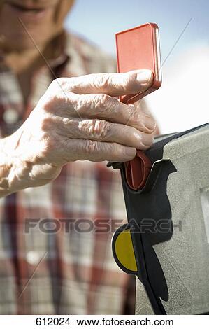 A senior man's hand opening the mailbox View Large Photo Image Picture - A senior man's hand opening the mailbox. Fotosearch