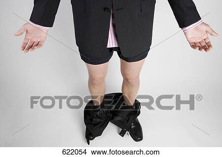 A businessman caught with his pants down View Large Photo Image Picture - A businessman caught with his pants down. Fotosearch