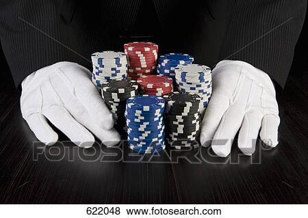 A croupier with gambling chips View Large Photo Image Stock Photo - A croupier with gambling chips. Fotosearch