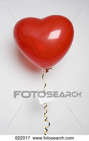 A heart shaped balloon with a love note View Large Photo Image Stock Photo - A heart shaped balloon with a love note. Fotosearch