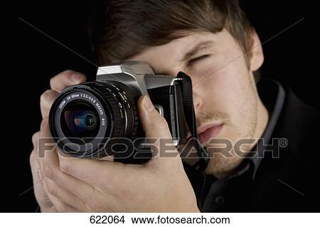 A man taking a photograph View Large Photo Image Picture - A man taking a photograph. Fotosearch