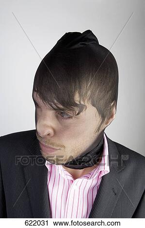 A robber wearing a disguise View Large Photo Image Stock Image - A robber wearing a disguise. Fotosearch