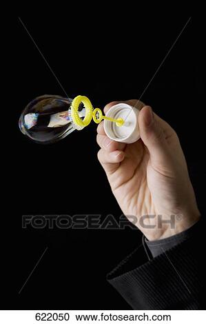 Making a bubble with a bubble wand View Large Photo Image Stock Image - Making a bubble with a bubble wand. Fotosearch